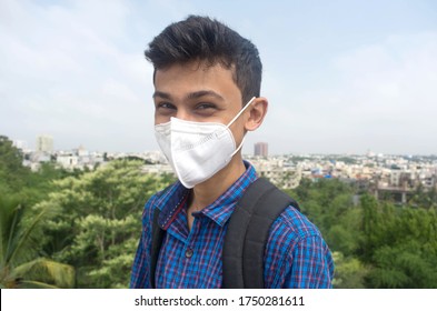 Young Teen College Boy Wearing Face Mask And Smiling.