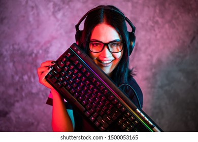 Young Teen Gamer Wearing Glasses Standing Posing With Computer Gaming Equipment