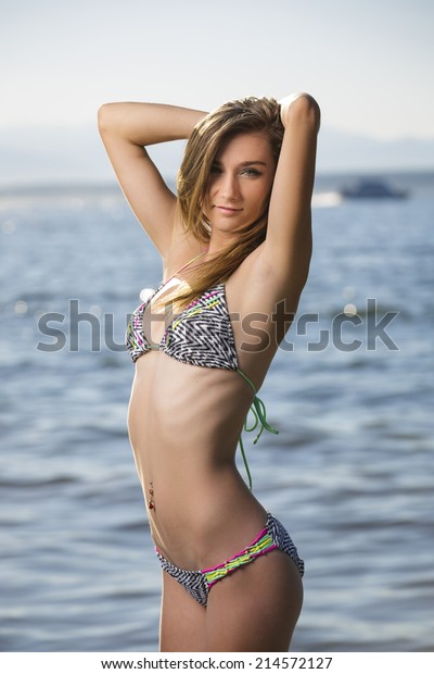Young Teen Girl Bikini Swimwear Posing 库存照片 立即编辑