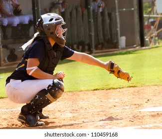 Young Teen Girl Playing Softball In Organized Game