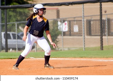 Young Teen Girl Playing Softball In Organized Game