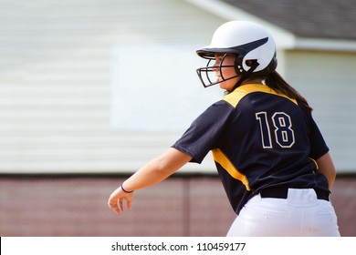 Young Teen Girl Playing Softball In Organized Game