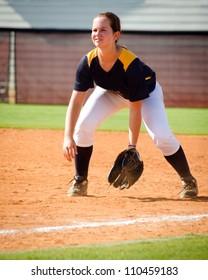 Young Teen Girl Playing Softball In Organized Game