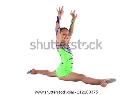 Young teen gymnast doing split in green costume