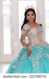 Young Teen Hispanic Girl Wearing A Quinceanera Dress