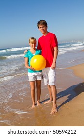 Young Teen Sister And Brother On Beach