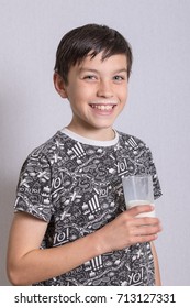 Young Teenage Boy With A Milk Moustache After Drinking Milk