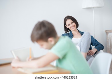 Young Teenage Boy Studying At Desk