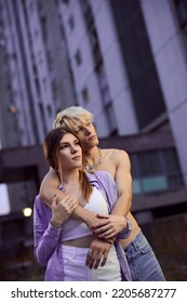 A Young Teenage Couple Is Hugging Outside And Expressing Love.