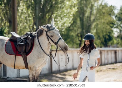 Young Teenage Girl Equestrian Having Fun With Her Favorite Horse. Dressage Outfit