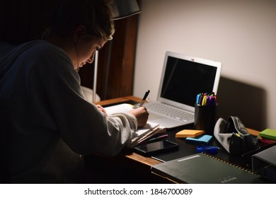 Young Teenage Girl Student Studying Late At Night In Her Room