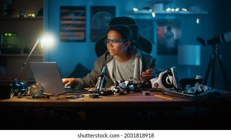 Young Teenage Multiethnic Schoolgirl Is Studying Electronics And Soldering Wires And Circuit Boards In Her Science Hobby Robotics Project. Girl Is Working On A Robot In Her Room. Education Concept.