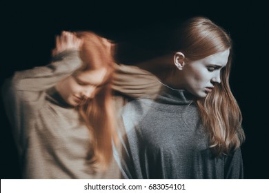 Young teenager with crushing mental illness turning her head away in a depression concept - Shutterstock ID 683054101