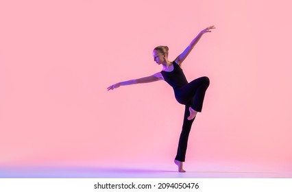 Young teenager dancer dancing on red studio background. Ballet, dance, art, modernity, choreography concept - Powered by Shutterstock