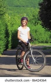 Young teenager girl mountain biking - Shutterstock ID 86424364