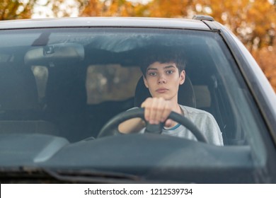 young teenager learns how to drive the car 