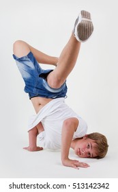 Young Teenager White B-boy Dancing Break Dance.Little Hip Hop Dancer Guy Isolated On White.Good Looking Teen Posing In Studio.Hip Hop Culture