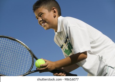 Young Tennis Player Preparing to Serve