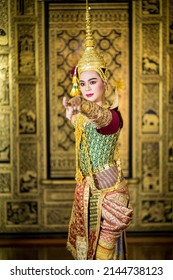 A young Thai man dressed in a beautiful pantomime dressed in the character of "PhraRam" dancing in a Thai pantomime performance; Khon is traditional dance drama art of Thai classical masked "Khon"