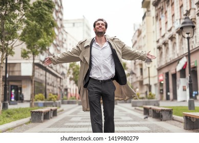 Young thankful man walking the urban streets of his city, appreciating life and the beauty around him, positive mindset - Shutterstock ID 1419980279