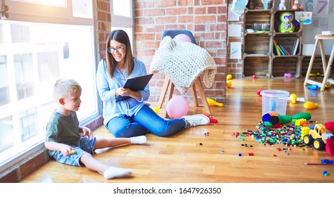 Young Therapist Woman Speaking With Child, Counselor And Behaviour Correction At The Office Around Toys