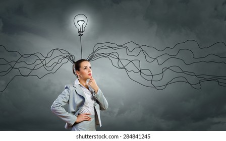 Young thoughtful businesswoman and thoughts coming out of her head - Shutterstock ID 284841245