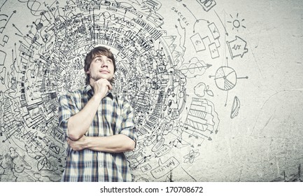 Young thoughtful handsome man in casual thinking over the ideas