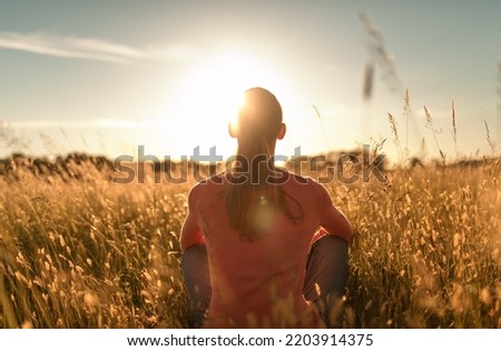 Similar – Image, Stock Photo Young woman looking at the sunset.