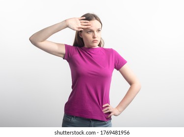 Young Tired Caucasian Woman In Violet T-shirt Wipping Sweat From Her Brow, Isolated On White Background