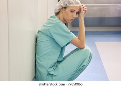 A Young Tired Doctor Or Nurse After Surgery