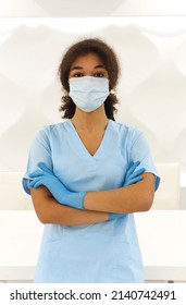 Young Tired Overworked African American Medical Worker Wearing Protective Face Mask Looking To The Camera With Frustrated Expression. Healthcare Workers During COVID-19 Pandemic