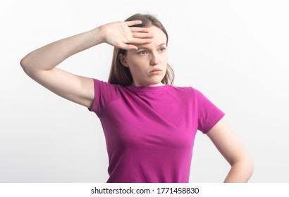 Young Tired And Shocked Caucasian Woman In Violet T-shirt Wipping Sweat From Her Brow, Isolated On White Background