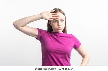 Young Tired And Shocked Caucasian Woman In Violet T-shirt Wipping Sweat From Her Brow, Isolated On White Background