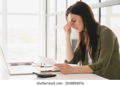 Young tired stressed overworked businesswoman freelancer teacher student exhausted after hard work, suffering from migraine headache at office. Deadline, fired worker, debt, problems concept