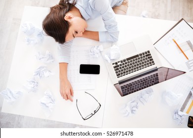 Young Tired Woman At Office Desk Sleeping With Eyes Closed, Sleep Deprivation And Stressful Life Concept