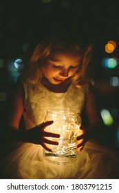 Young Toddler Girl Holding Magic Fairy Lights