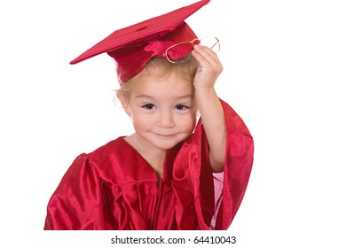 Young toddler scholar dressed in graduation cap and gown.