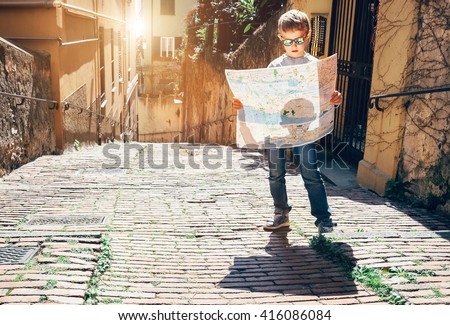 Young tourist with city map stay on the old italian street