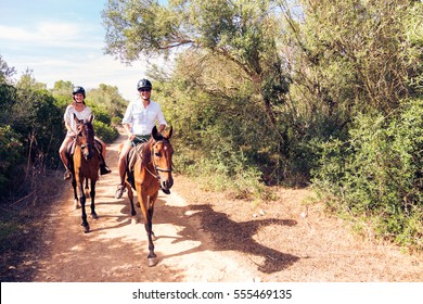 Young Tourist Couple Horseback Riding - Shutterstock ID 555469135