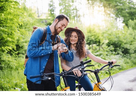 Similar – Image, Stock Photo Girl using electric scooter in the street in downtown rented by using service on smartphone. Candid people, real moments, authentic situations