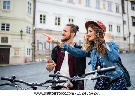 Similar – Image, Stock Photo Girl using electric scooter in the street in downtown rented by using service on smartphone. Candid people, real moments, authentic situations