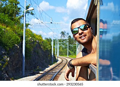 A Young Tourist Enjoy A Train Ride