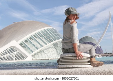 Young tourist female posing in front of a the beautiful building of Valencia