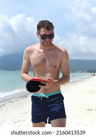 Young Tourist Man Smiles At Doc Let Beach Of Vietnam With White Sand