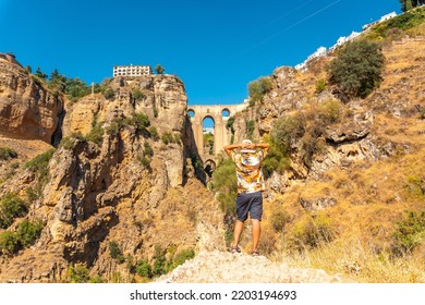 A Young Tourist Visiting The New Bridge Viewpoint In Ronda Province Of Malaga, Andalucia