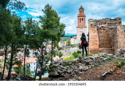 Young Tourist Walking And Enjoying The Old Streets Of The Town Of Jérica (Castellón - Spain)
