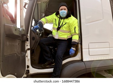young transporter on the truck with face mask and protective gloves for Coronavirus