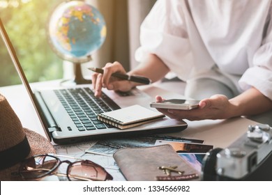 Young traveler planning vacation trip and searching information or booking hotel on laptop, Travel concept - Powered by Shutterstock