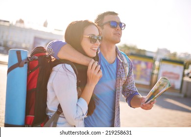 Young travelers with map traveling in a city - Powered by Shutterstock