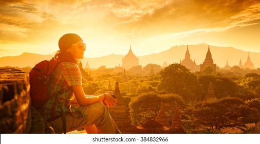 Young traveller enjoying a looking at sunset on Bagan, Myanmar Asia. Panoramic view.
Traveling along Asia, active lifestyle concept. 